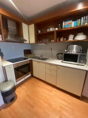 a kitchen with a sink and a microwave at Lavish, Poolside 2 Bed Apt at Garden of Eden in Sveti Vlas