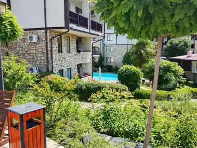 a garden with a house and a swimming pool at Етъра - 2 Rey&Mar Свети Влас in Sveti Vlas