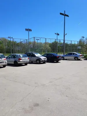 a group of cars parked in a parking lot at Comfort apartment near the beach in Varna City