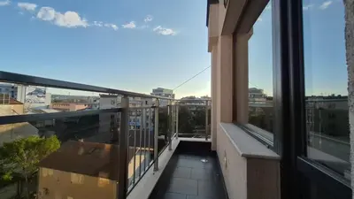 an apartment balcony with a view of a city at Cozy Corner in Varna - Free Parking in Varna City
