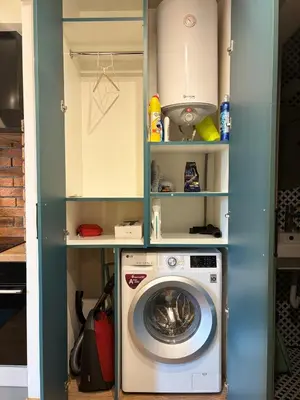 a washer and dryer in a utility room with shelves at Cozy Corner in Varna - Free Parking in Varna City