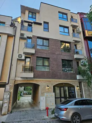 a building with a car parked in front of it at Cozy Corner in Varna - Free Parking in Varna City