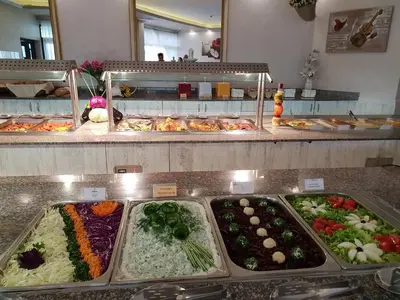 a buffet line with many different types of food at Grenada Complex All Inclusive in Sunny Beach