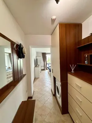 a kitchen with a washer and dryer in a room at Oasis Premium Studio in Lozenets