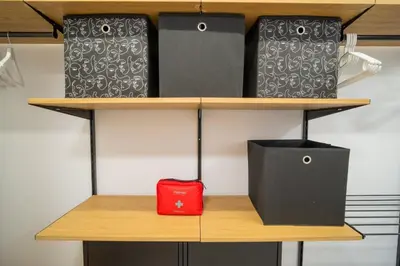 a shelf with boxes and a red bag on it at Бургаски вечери Burgas nights in Burgas City