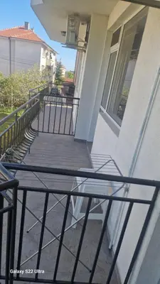 a balcony of a building with a basketball hoop at Къща за гости Ravda in Ravda
