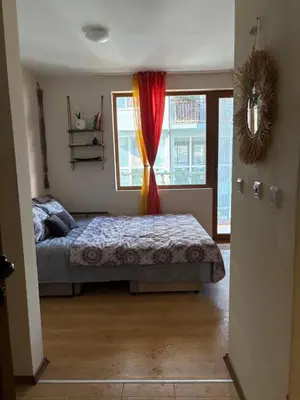 a bedroom with a bed and a window at Cozy studio in Sunny beach in Sunny Beach