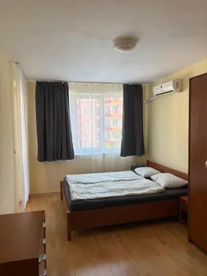 a bedroom with a bed in front of a window at Amartmán přímo u moře - Elenite in Sveti Vlas