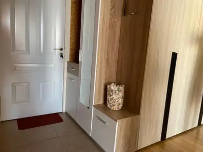 a door with a bag sitting on a shelf next to it at Amartmán přímo u moře - Elenite in Sveti Vlas