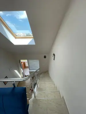 a room with a skylight and a staircase with a window at Sea Diamond 2 in Sunny Beach