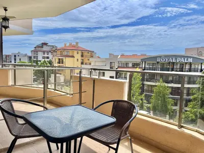 a balcony with a table and chairs and a view of a city at Millennium 2 - Private apartment - BSR in Sveti Vlas