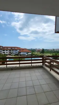 a view of a balcony with a wooden fence at Apartamenty na Zielonych Wzgórzach in Sunny Beach