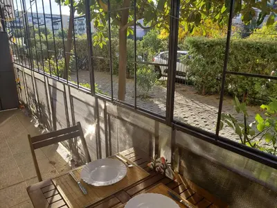 a balcony with a table and chairs and a window at 2 Zimmer Wohnung in Sunny Beach in Sunny Beach