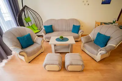 a living room with two couches and a coffee table at The Sea Balcony - 1BD Apartment by Flat Mаnager in Burgas City