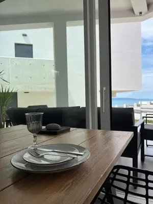 a wooden table with a plate and a glass on it at Slow Living House in Lozenets