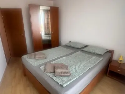 a bedroom with a bed with two towels on it at Amartmán přímo u moře - Elenite až 5 osob in Sveti Vlas