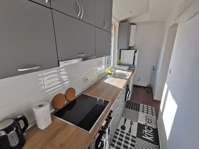 a kitchen with a sink and a stove top oven at Emona 5 floor 4 in Burgas City