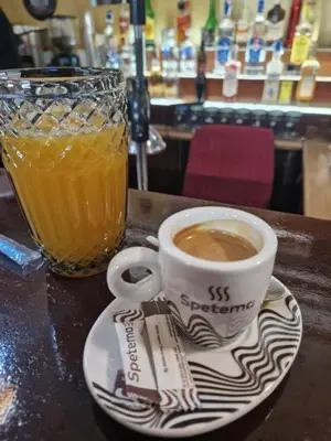 a cup of coffee on a plate next to a drink at NEU 2025 Emila Romana Boutique- Modernes Luxury Living in Sunny Beach
