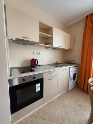 a small kitchen with a stove and a dishwasher at VP Royal Sun in Sunny Beach