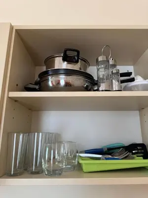 a cupboard with a pot and glasses on it at VP Royal Sun in Sunny Beach