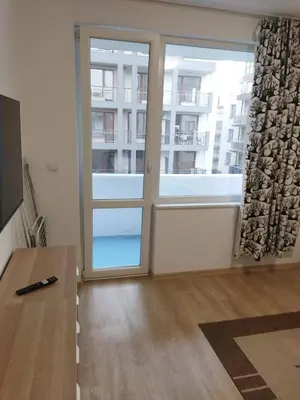 a room with a sliding glass door with a window at Emona 5 floor 3 in Burgas City