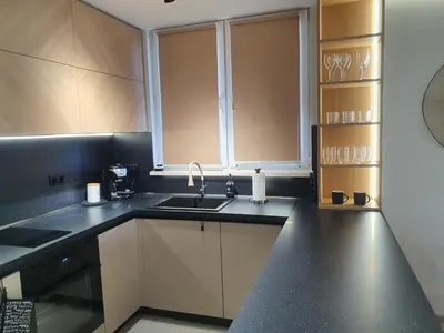 a kitchen with a sink and a counter top at Divalla Apartment Burgas in Burgas City