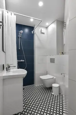 a bathroom with a white sink and a toilet at Sea Moreto Apartment 3 in Burgas City