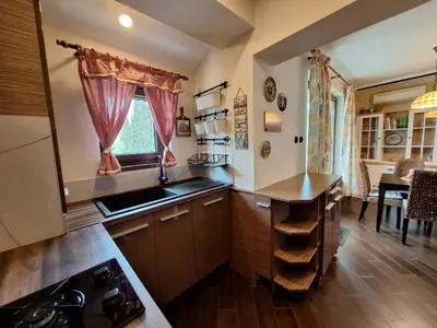 a kitchen with a sink and a counter top at Veneto Apartment in Varna City