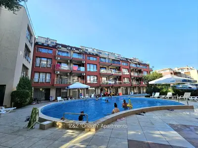 a large swimming pool in front of a building at Z&Z 