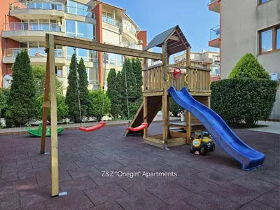 a playground with a slide and a play structure at Z&Z 