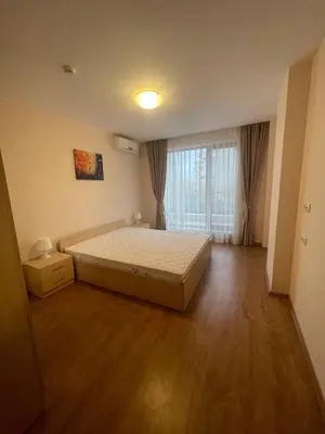 a bedroom with a bed and a large window at Premier Fort Beach Hotel ! in Sveti Vlas
