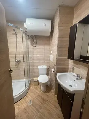 a bathroom with a toilet and a sink and a shower at Premier Fort Beach Hotel ! in Sveti Vlas