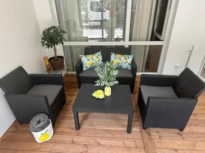 a living room with two chairs and a table at La Terrassa 7 in Burgas City