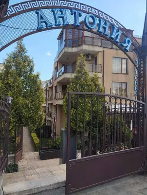 an entrance to a building with a sign on it at Quiet 1-Bed Flat in Antonia Complex by Flat Mаnager in Sveti Vlas