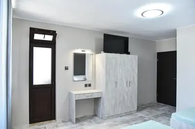 a bathroom with a sink and a mirror at Kaleya House in Chernomorets