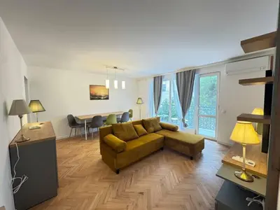 a living room with a couch and a table at Apartament A 2BD in Burgas City
