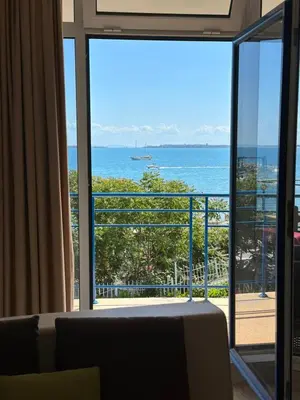 a living room with a view of the ocean at Vega View in Sveti Vlas