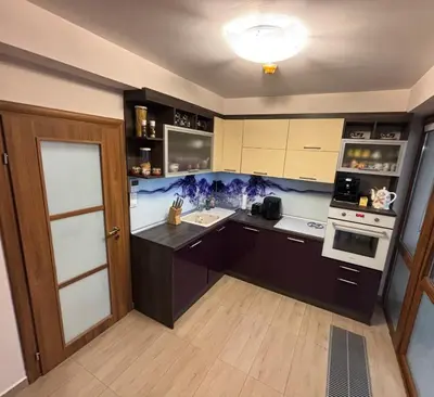 a kitchen with black counters and white appliances at Villa Amity in Varna City