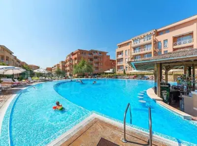 a large swimming pool with a person in the water at Sunny Day 6 in Sunny Beach