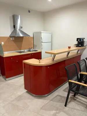 a kitchen with a wooden counter and a refrigerator at Miramar Palace 615 in Sunny Beach