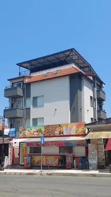 a building on the side of a street at Апартамент ReLax Китен in Kiten