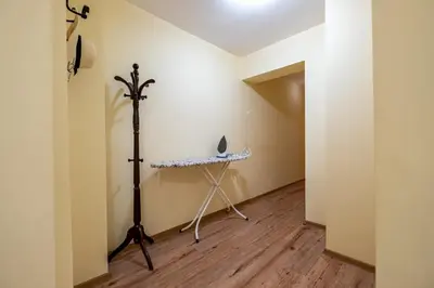 a room with a tripod and a table in the corner at Top Location 3 Bedroom Apartment Next to the Beach in Varna City
