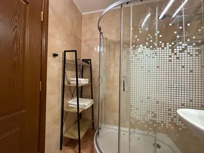 a bathroom with a shower and a glass shower stall at BW - Happy 67 in Sunny Beach