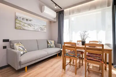 a living room with a couch and a table at Top Central Flats with Style in Varna City