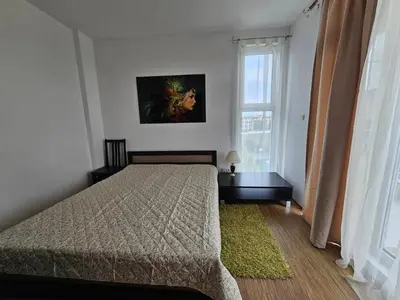 a bedroom with a bed and a window at Odisei Large Studio in Nesebar