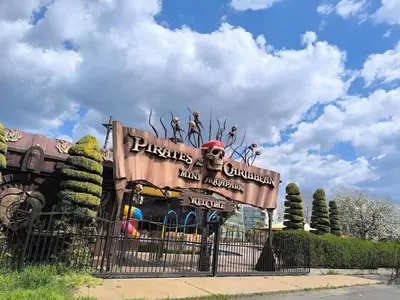 a sign at the entrance of a disney park at Golden Hermes, Studio z basenem in Sunny Beach