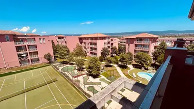 an aerial view of a tennis court and buildings at SUNNY DAY 6, Apartment 35 in Sunny Beach