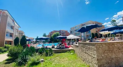 a swimming pool with umbrellas and chairs and a pool at SUNNY DAY 6, Apartment 35 in Sunny Beach