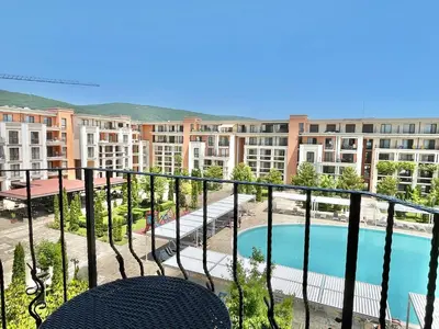 a balcony of a apartment with a swimming pool at Prestige Fort Aparthotel - Private apartment - BSR - 3 in Sveti Vlas