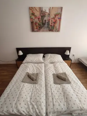a bedroom with two beds with pillows on them at Chocolate Apartment on Sunny Day 6 Complex in Tŭnkovo